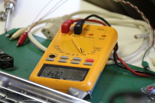 Testing voltage with a digital multimeter.